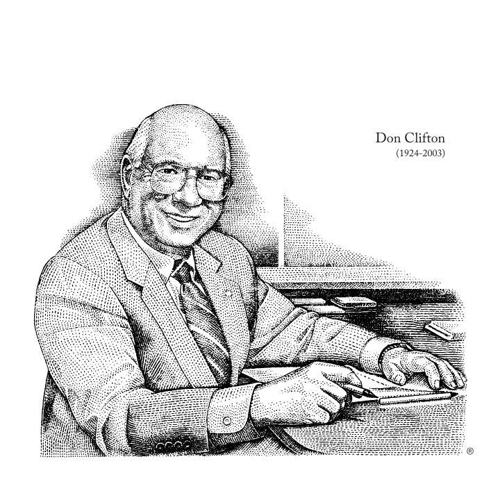 Don CLifton (1924-2003) smiling sitting at a desk