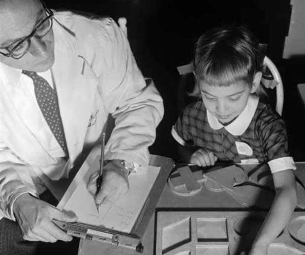 descriptive image of researcher and child