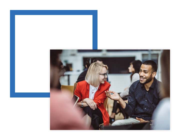 Image of two people talking in small group over image of a navy square
